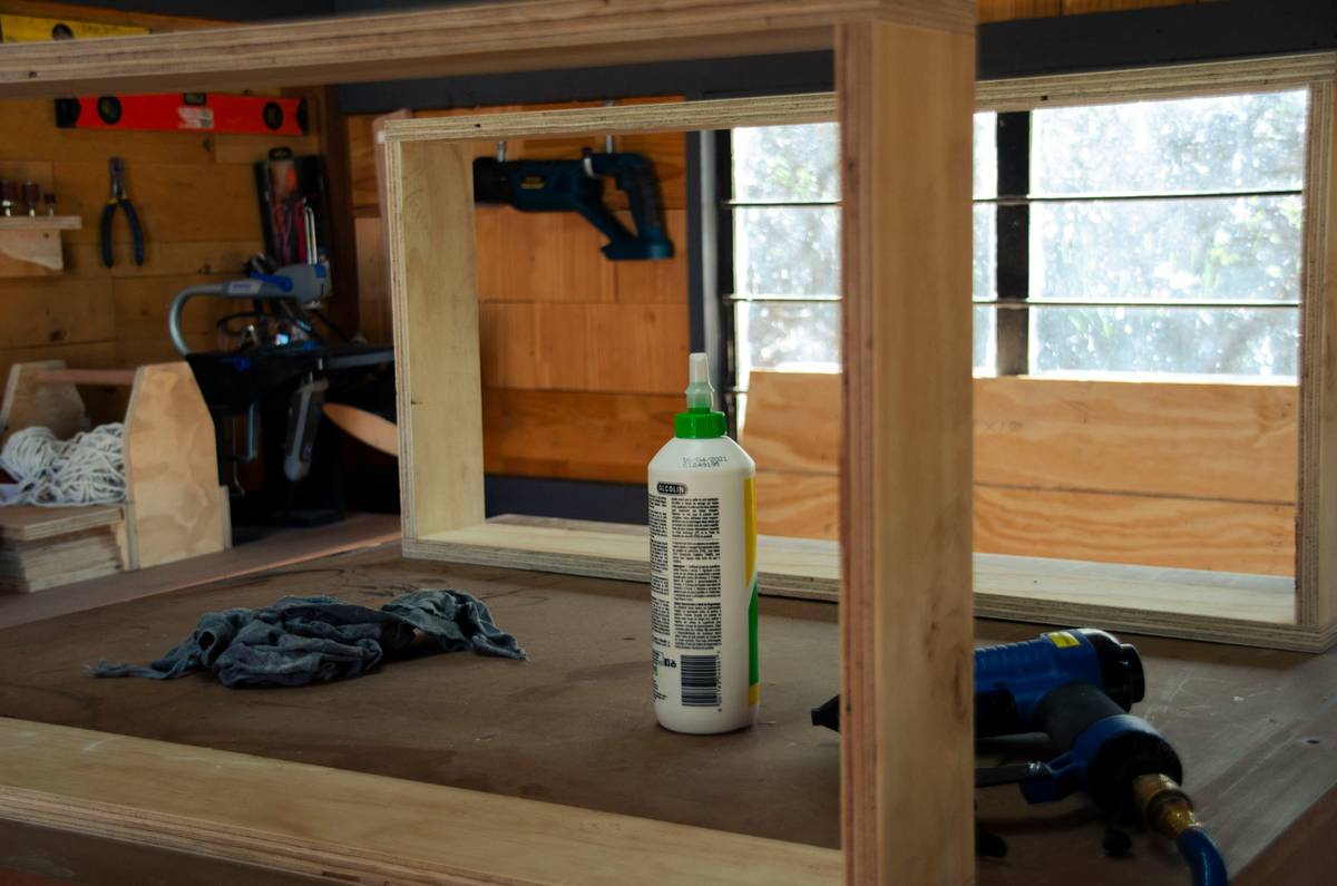 Wood glue and adhesives applied to oak joints during a DIY furniture repair project
