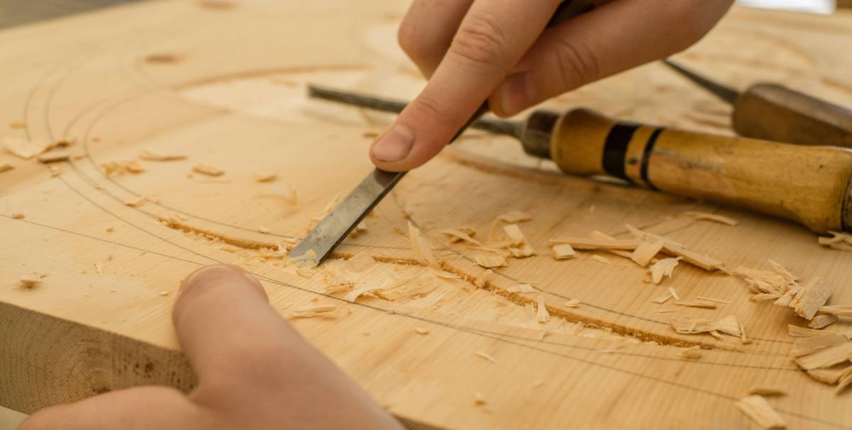 diy project wood glue how to: hand applying yellow carpenter's glue to wooden joint with brush