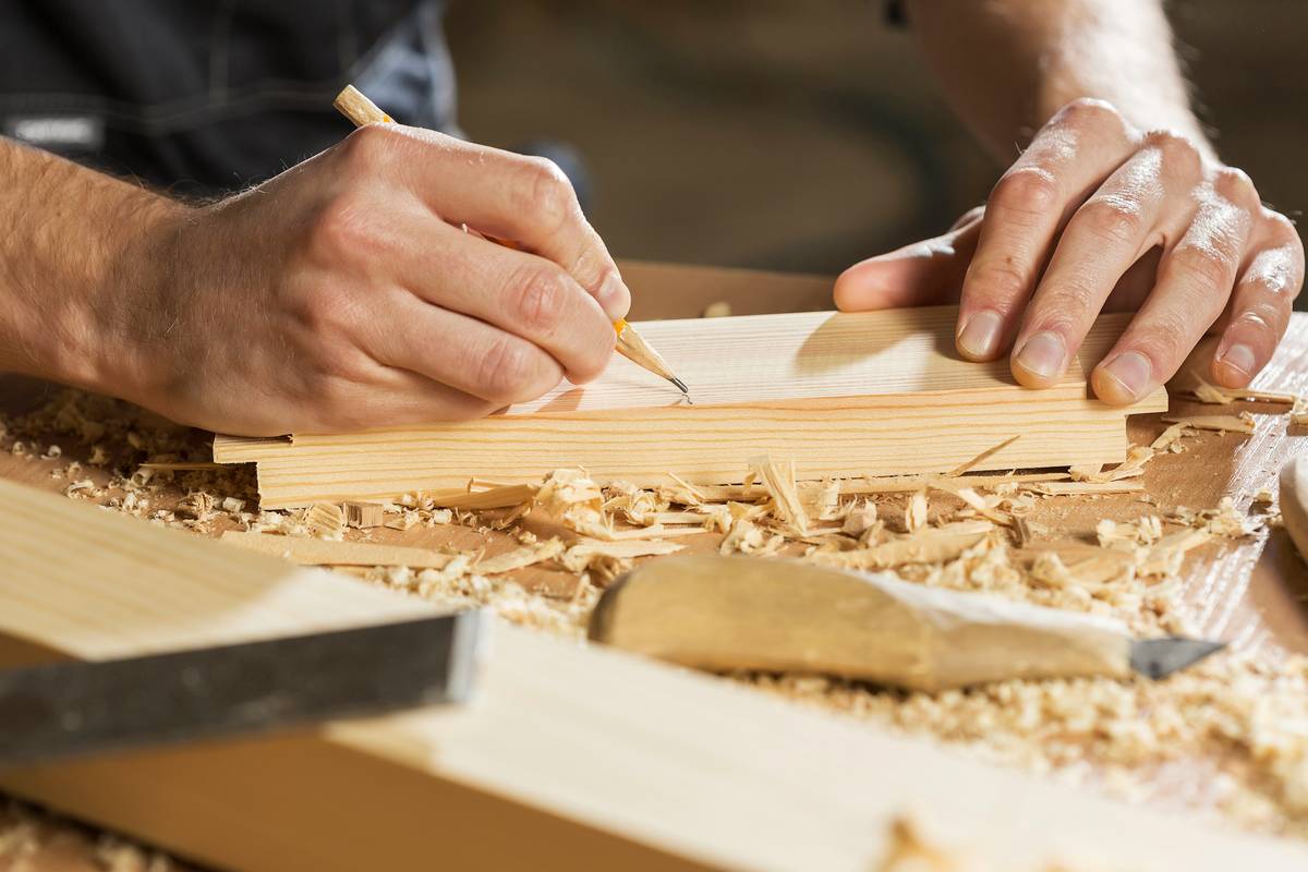 Close-up of wood pieces being joined with woodworking supply wood glue how to applied evenly along the edge